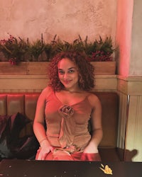 a woman sitting at a table in a restaurant